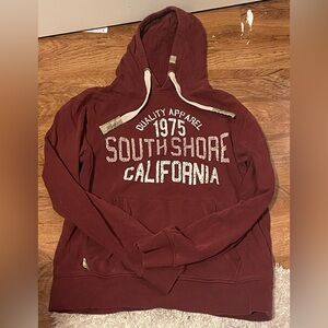 Dark red long sleeve hoodie with thick white hoodie cord